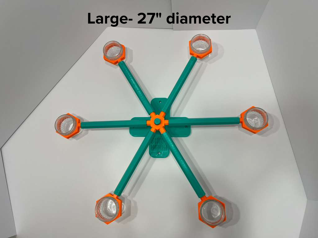 Large 27-inch scent wheel with bright orange scent cup holders and rotating spinners on a sturdy teal base and arms, built for professional detection dogs, AKC scent work trials, etc. scent cup holders have 4 oz glass jars for target odor. Photo for size, note of wheel for sale.
