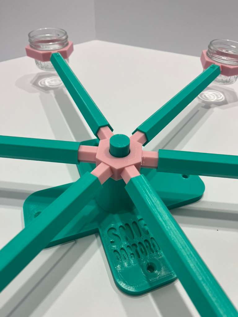 large scent wheel with mint green base and arms and sakura pink spinner and glass cup holders