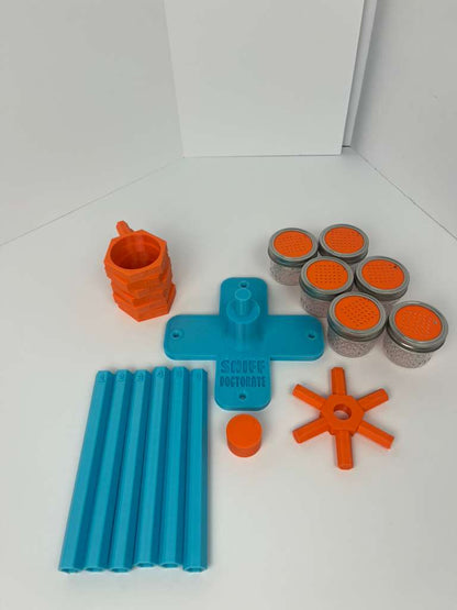 Large scent wheel with sky blue base and arms, sunny orange spinner, topper, cup covers, and cup holders