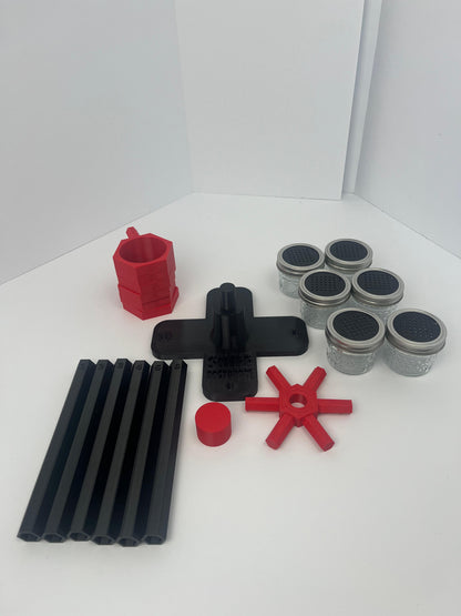 Large scent wheel with black base and arms, red spinner, topper, cup covers, and cup holders