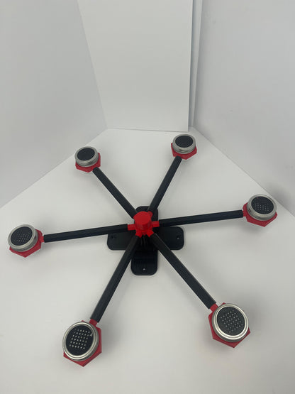Large scent wheel with black base and arms, red spinner, topper, cup covers, and cup holders
