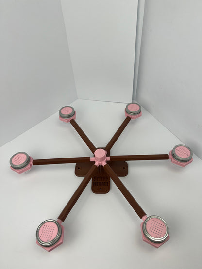 Large scent wheel with chocolate brown base and arms and sakura pink spinner, cup holders, cup covers, and base topper