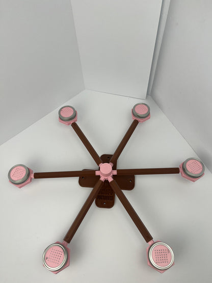 Large scent wheel with chocolate brown base and arms and sakura pink spinner, cup holders, cup covers, and base topper