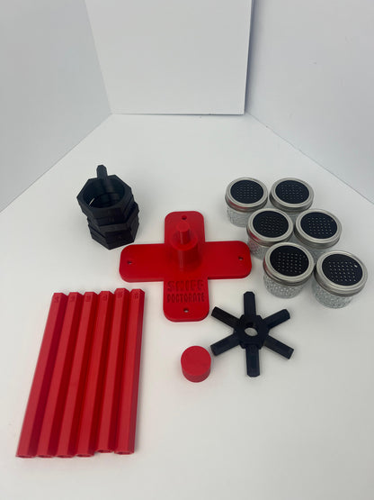 Large scent wheel with red base and arms and black spinner, cup holders, cup covers, and base topper